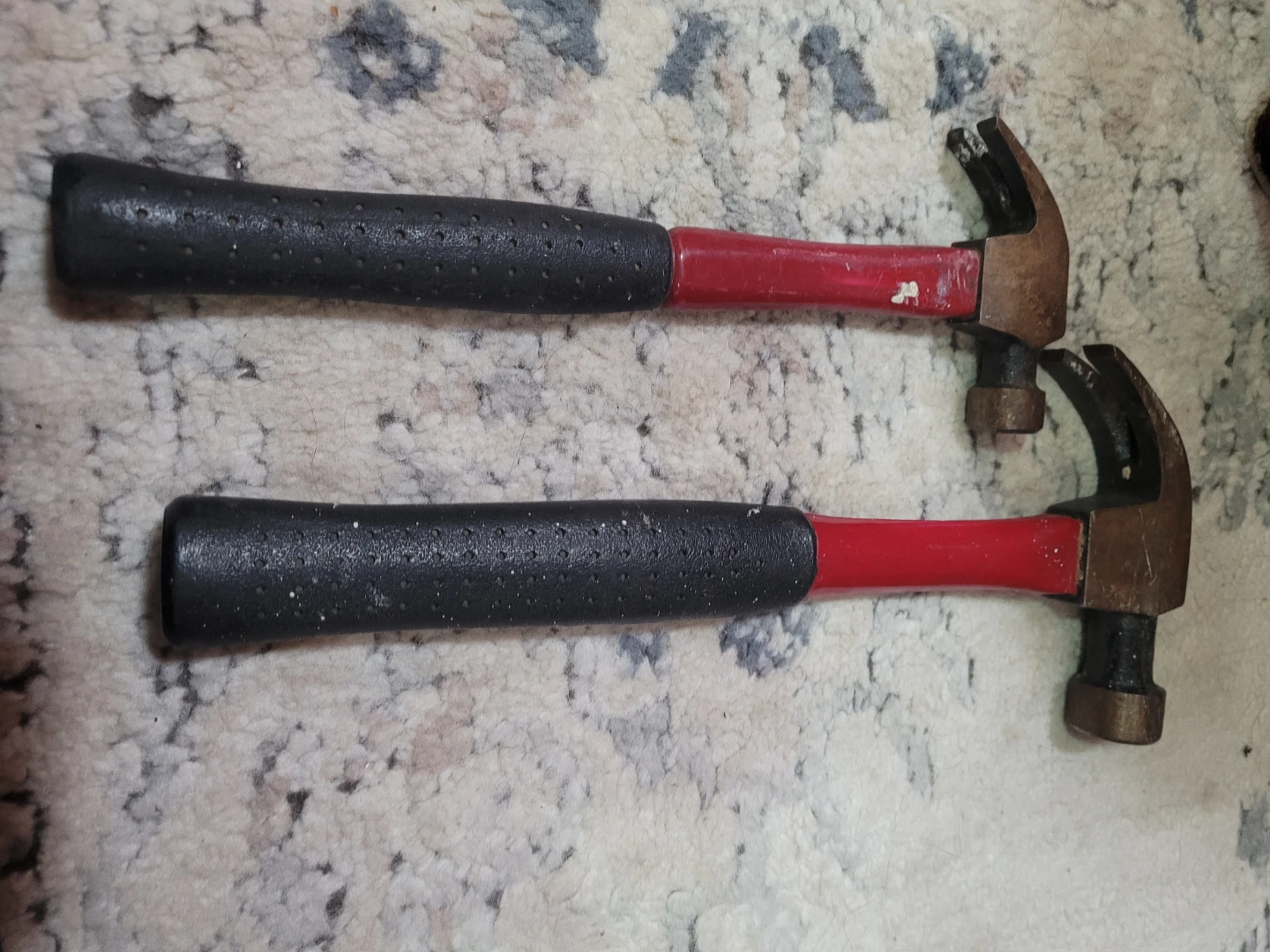 Two Claw Hammers with Black and Red Handles