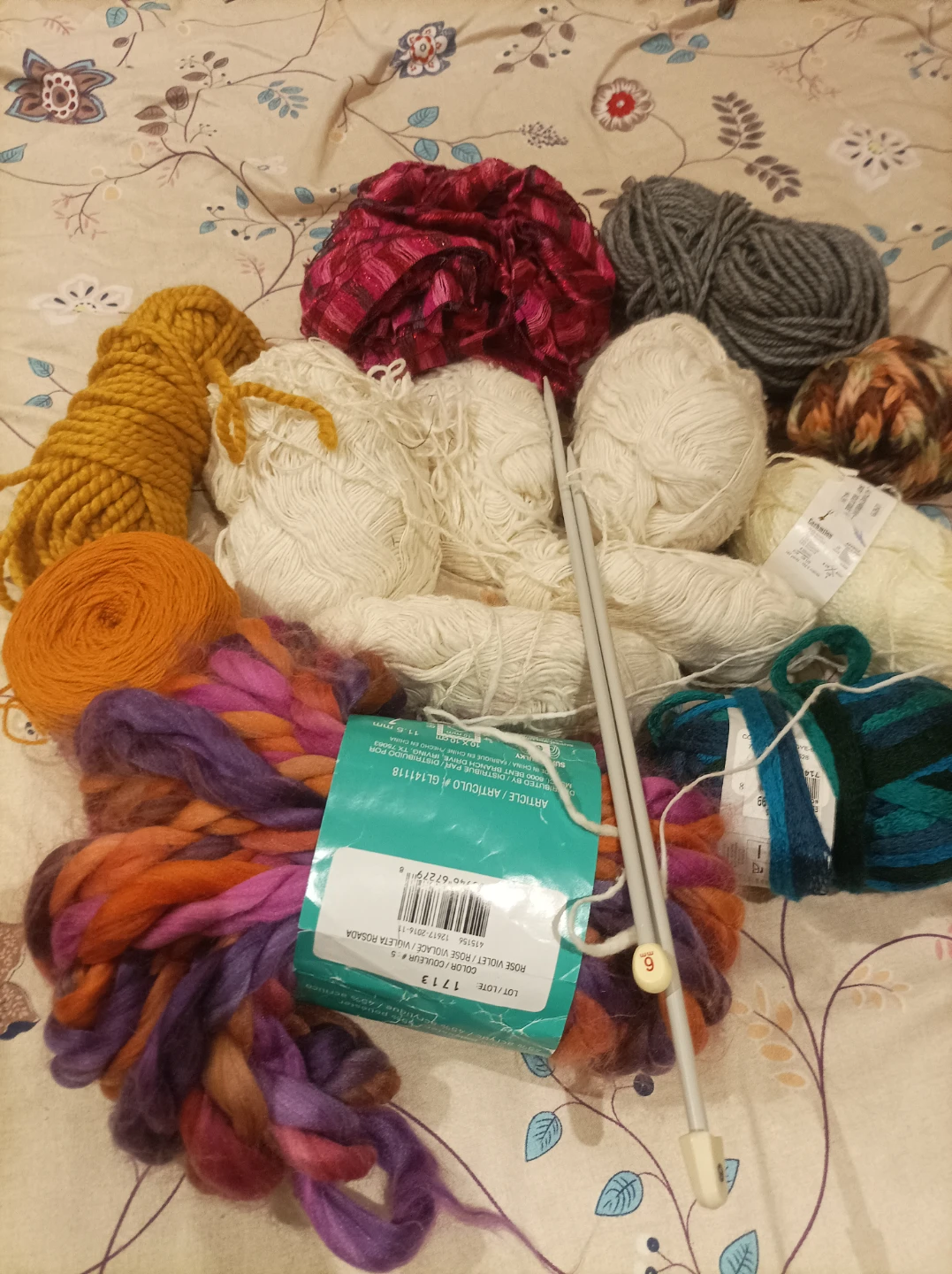 Assorted Yarn Skeins and Knitting Needles