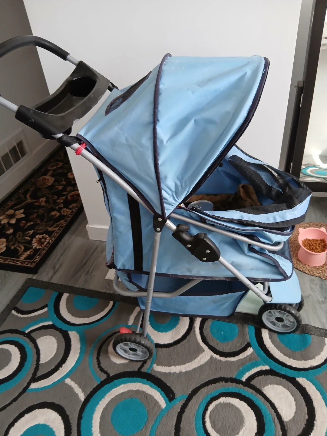 Blue Pet Stroller with Purina Dog Food and Fancy Feast Cat Food