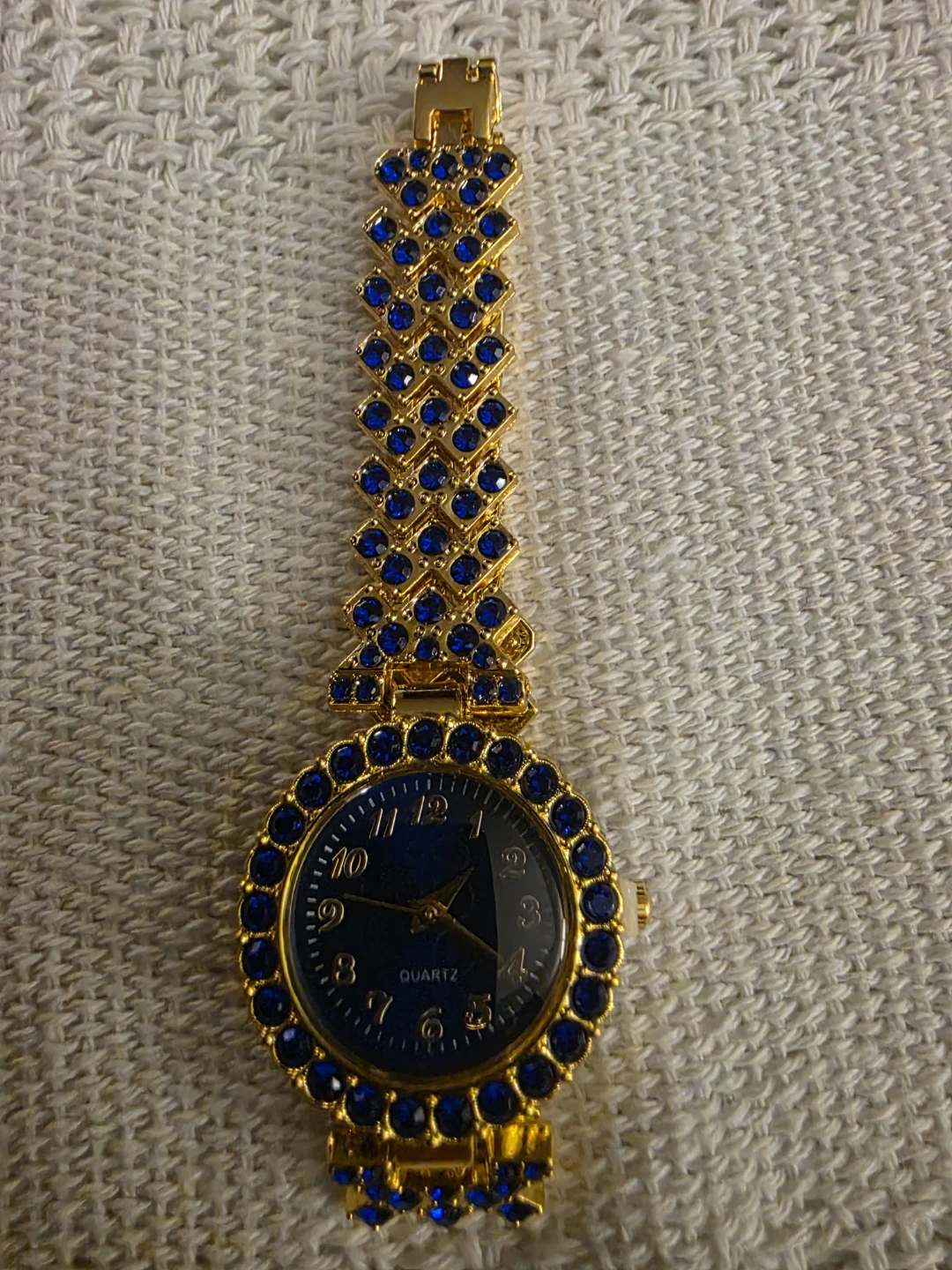 Gold-tone watch with blue accent bracelet - photo 2