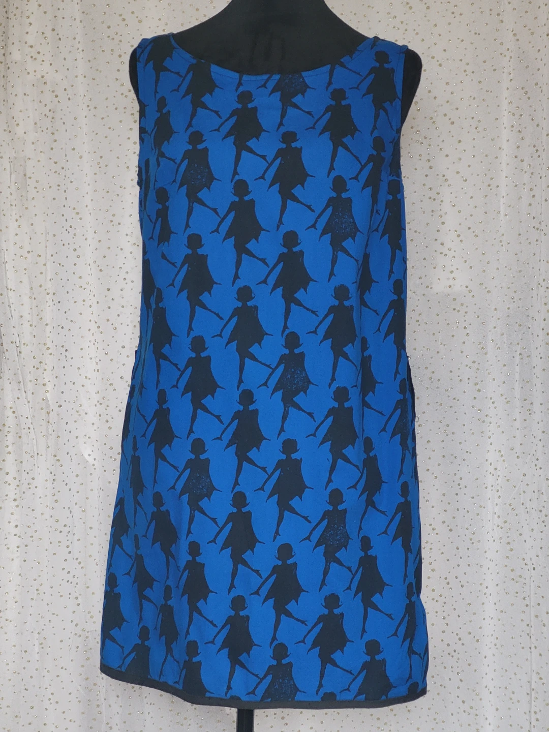 Blue sleeveless dress with black silhouette pattern