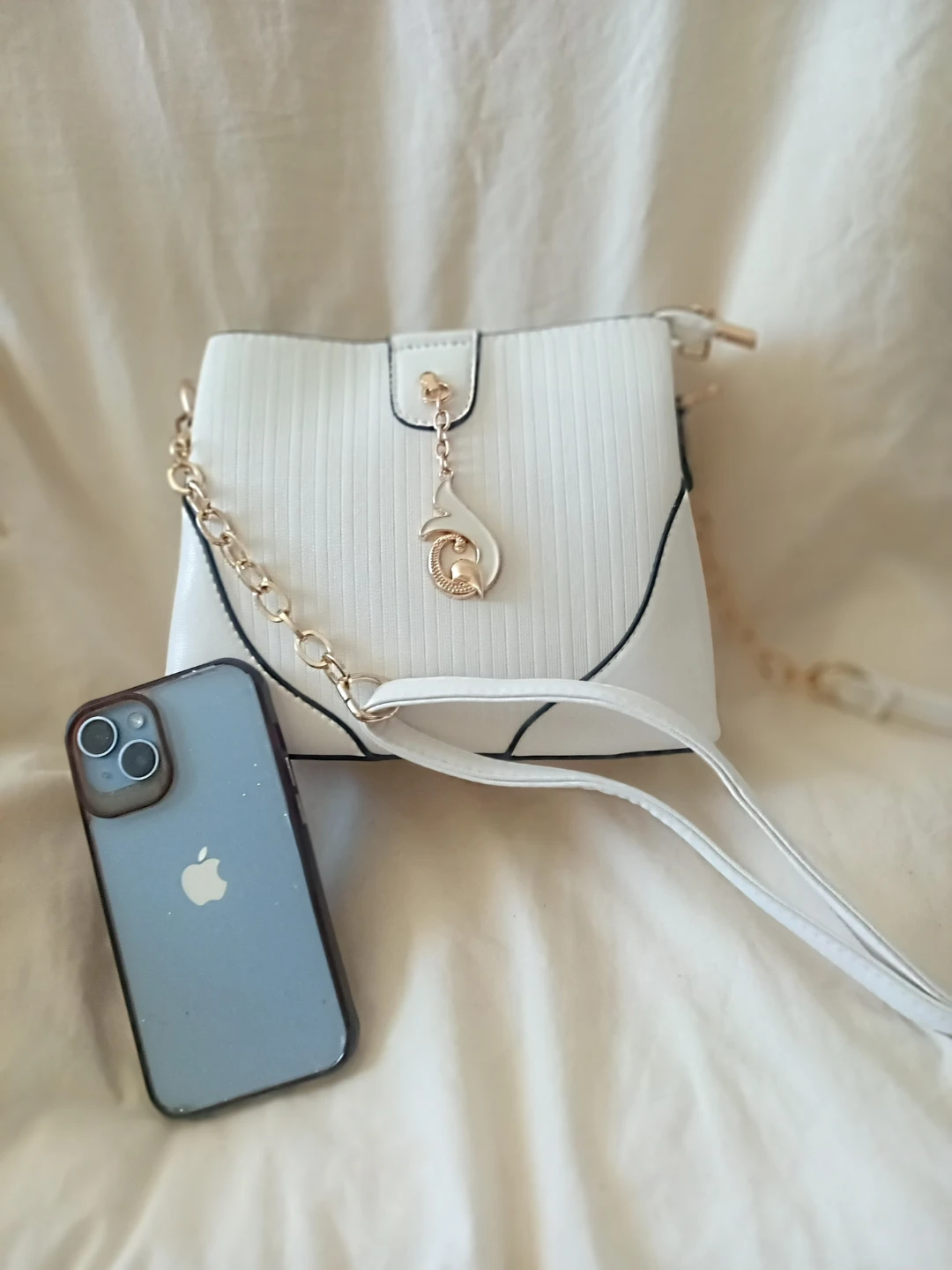 White crossbody purse with gold chain strap