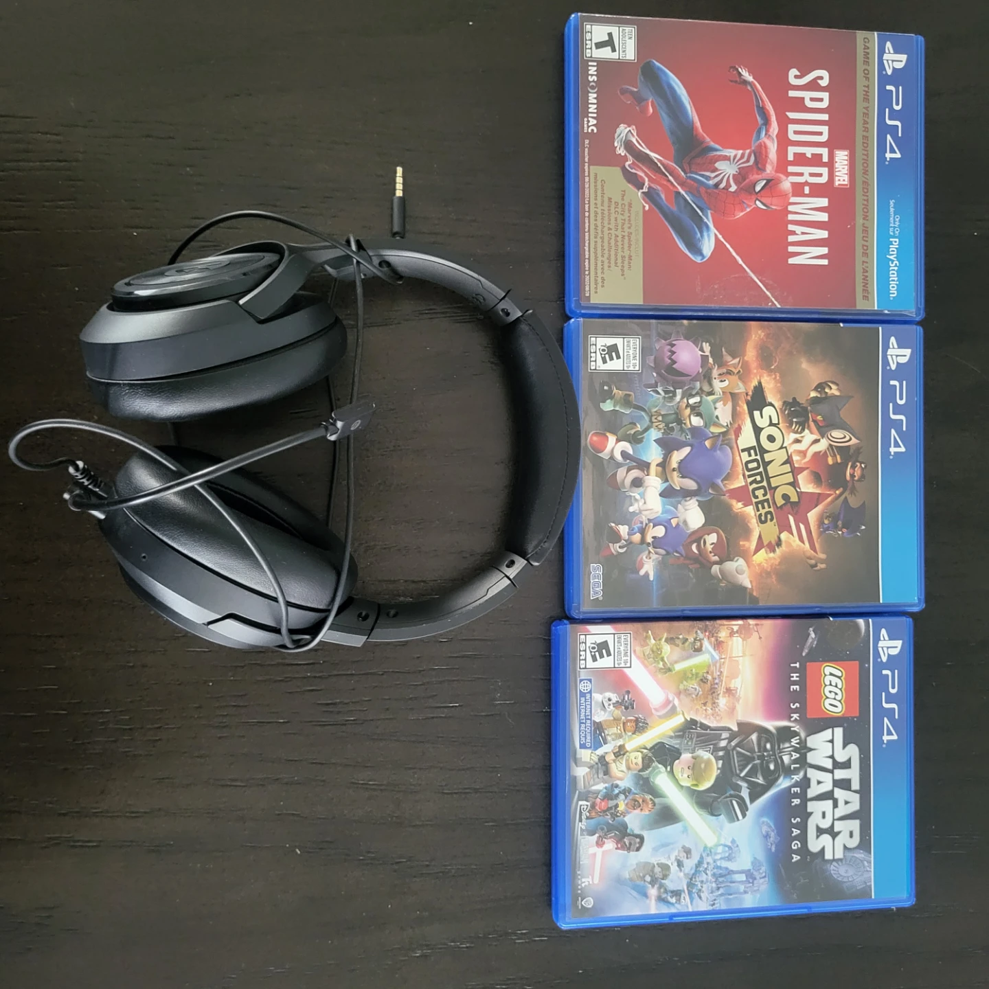 Black Over-Ear Headphones with PS4 Games