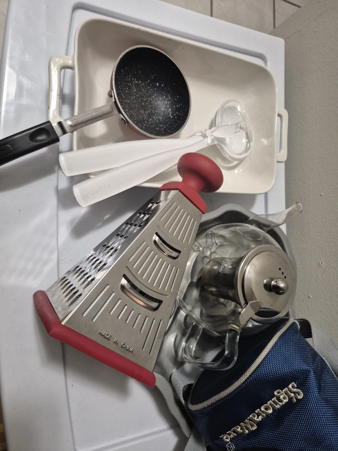 Assorted Kitchen Utensils: Grater, Small Pot, Teapot
