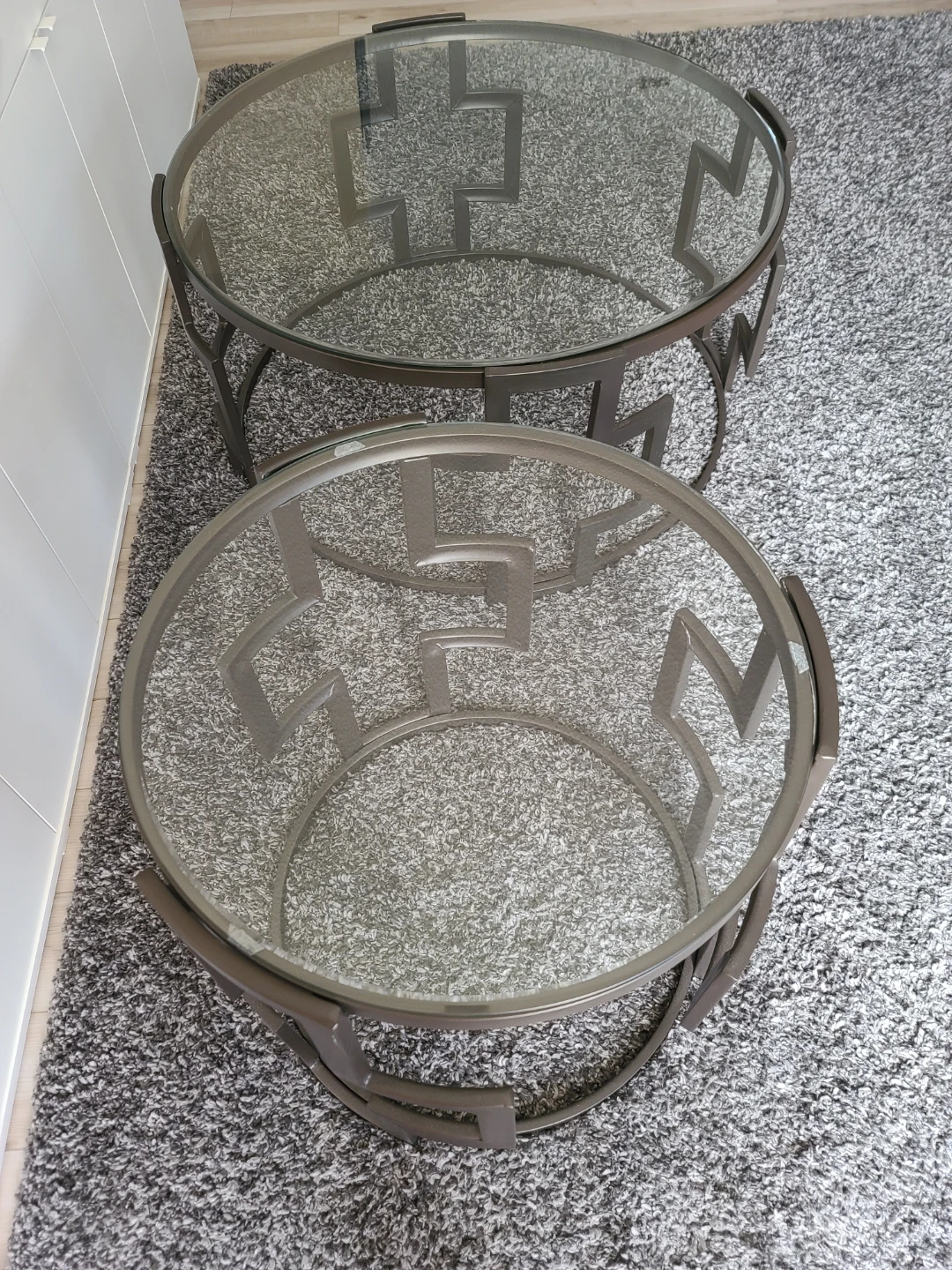 Glass top accent table with geometric metal base
