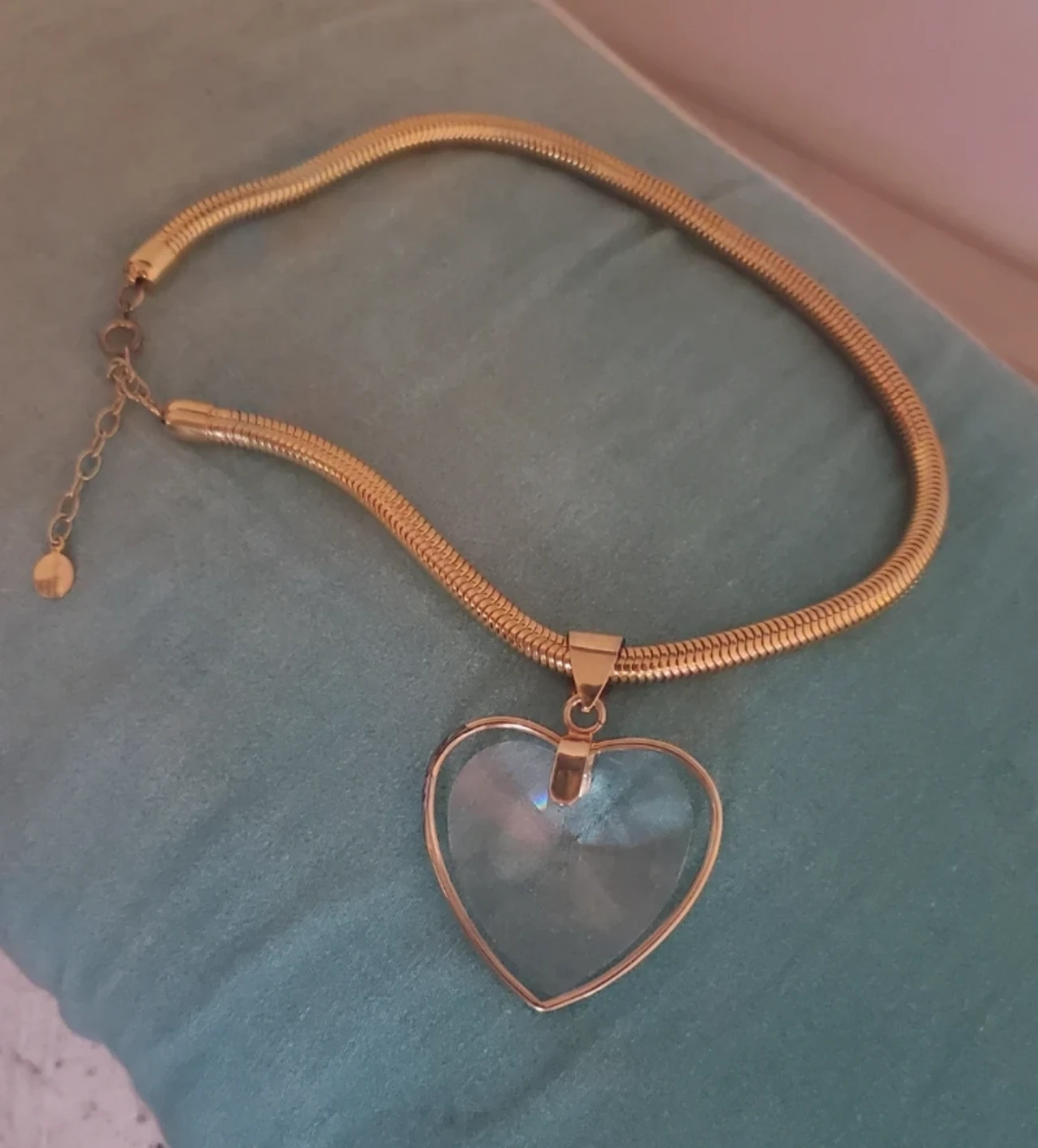 Gold snake chain necklace with clear heart pendant