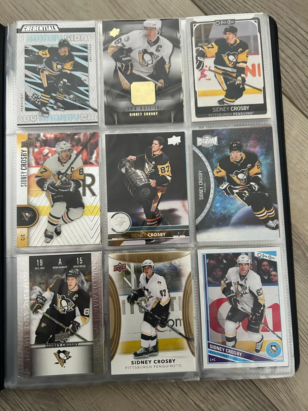 Sidney Crosby hockey card collection in binder