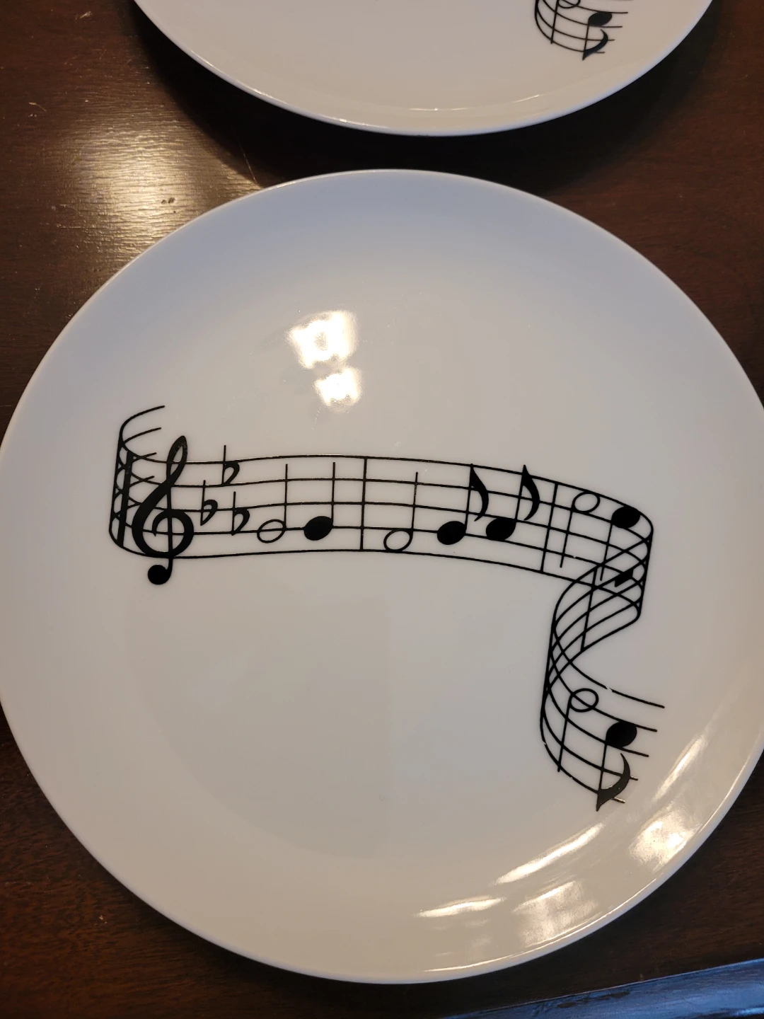 Set of 4 white plates with musical notes design