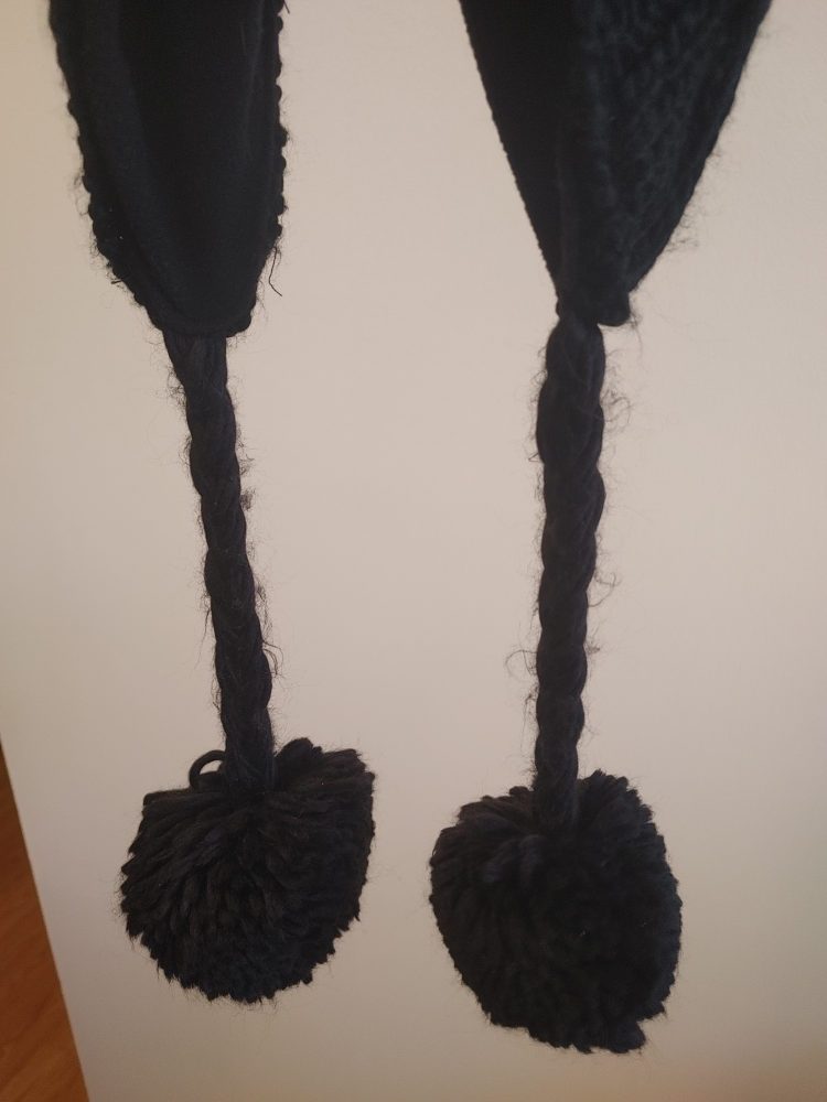 Black Knit Hat with Tassels and Pompom
