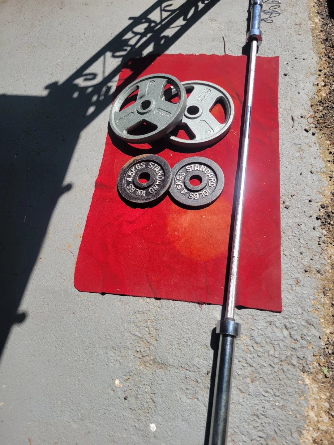 OLYMPIC 7' BAR.  45LBs AND 90LBs  2-35s. 2-10s