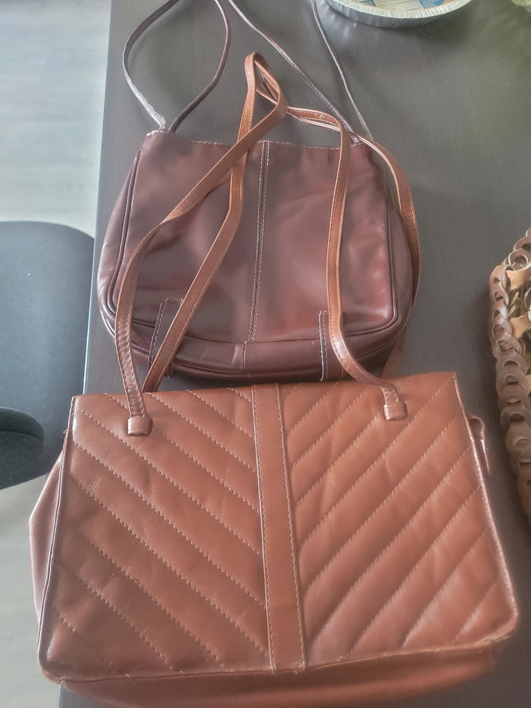 Two vintage brown leather handbags