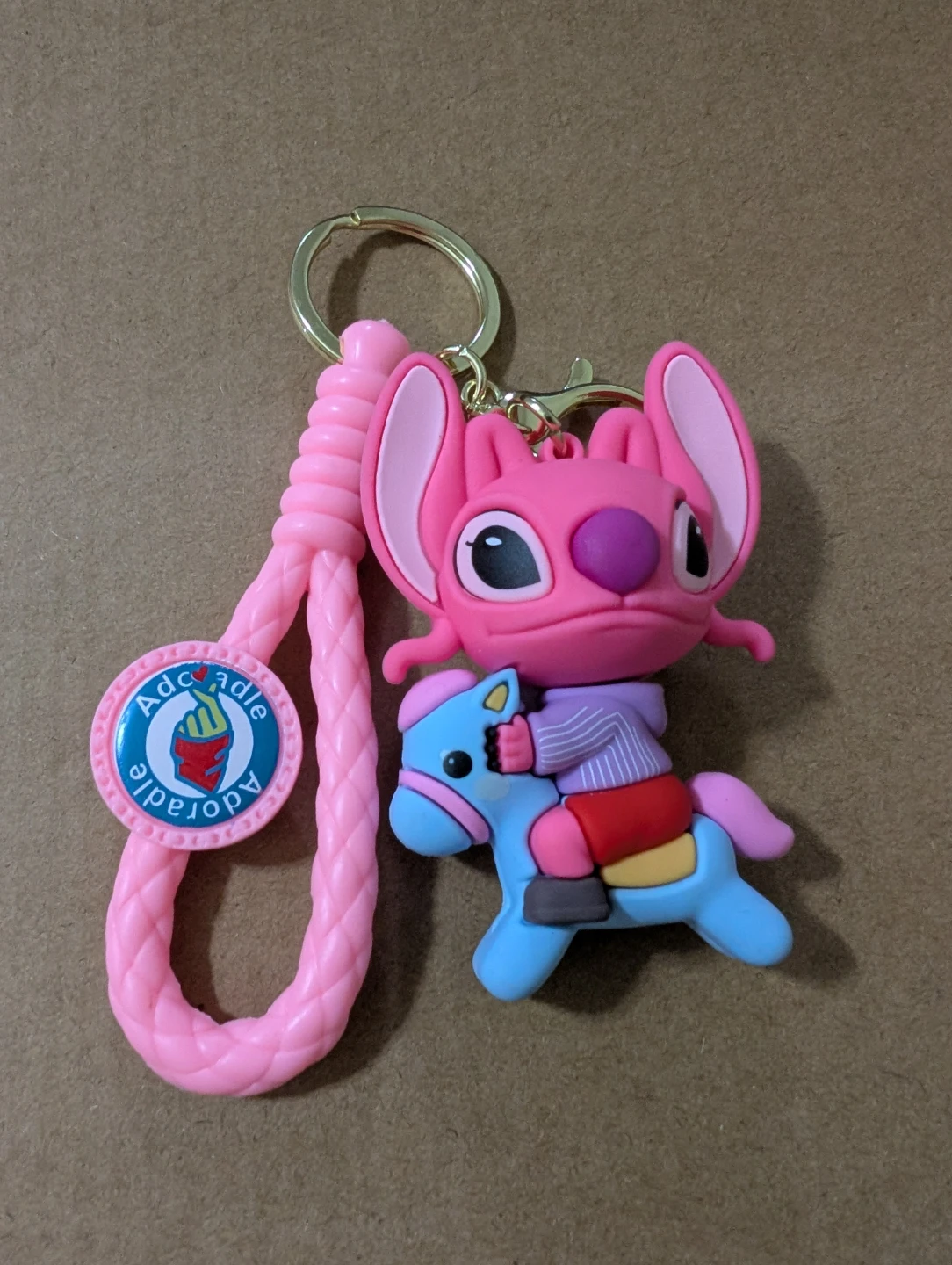 Pink Stitch Angel keychain riding a blue horse