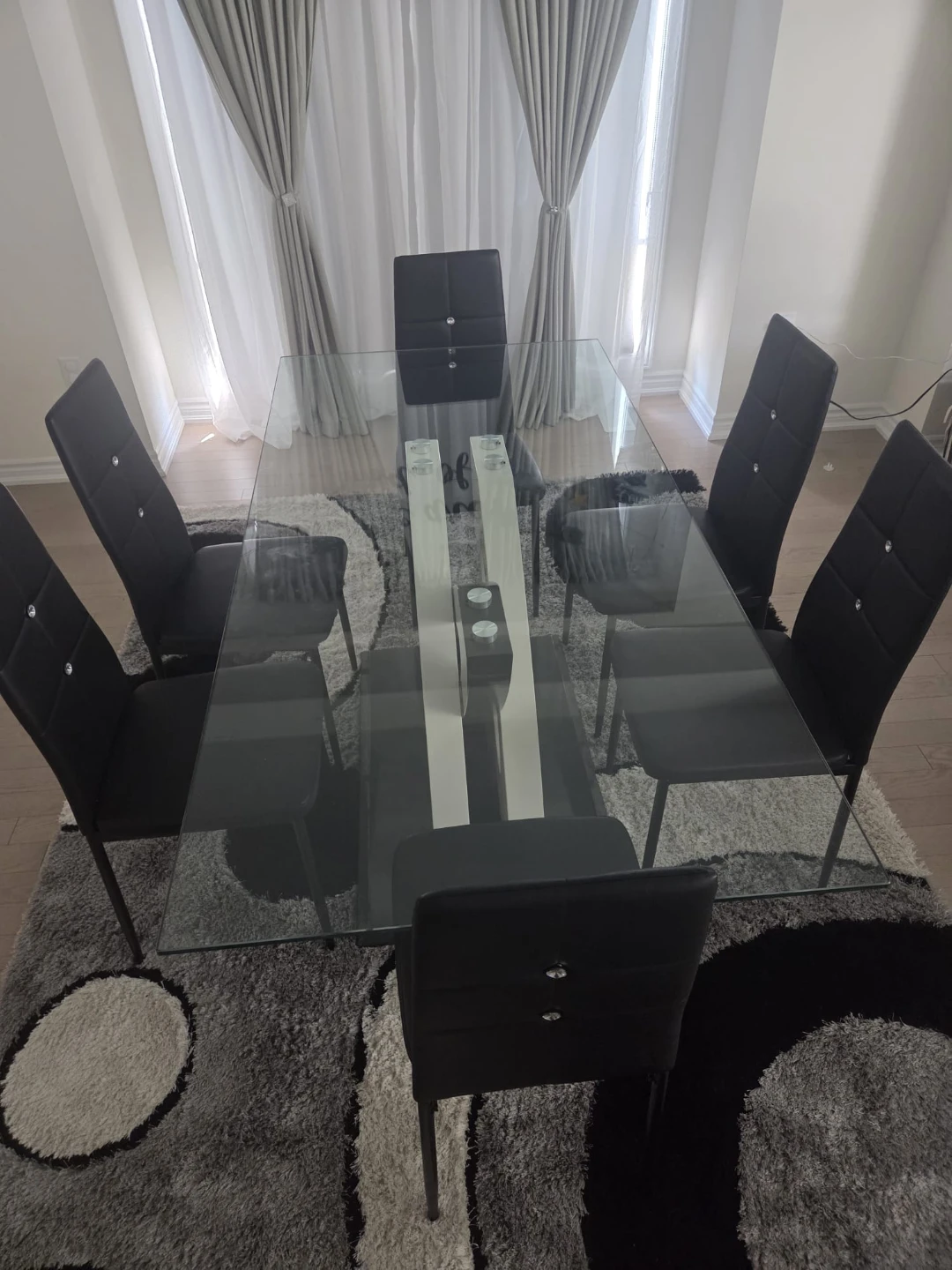 Glass Dining Table with 6 Black Chairs