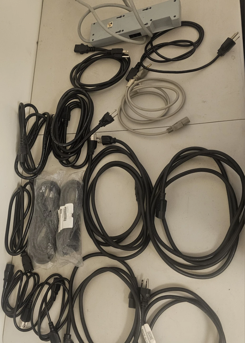 30$ Assorted Power Cords and Surge Protector