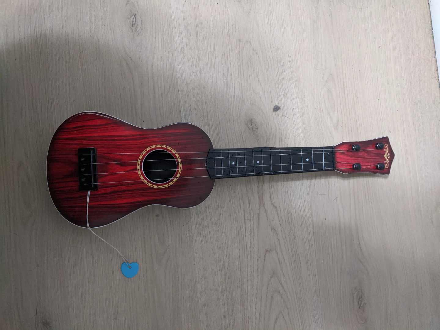 Small Red Wooden Ukulele for kids - photo 4