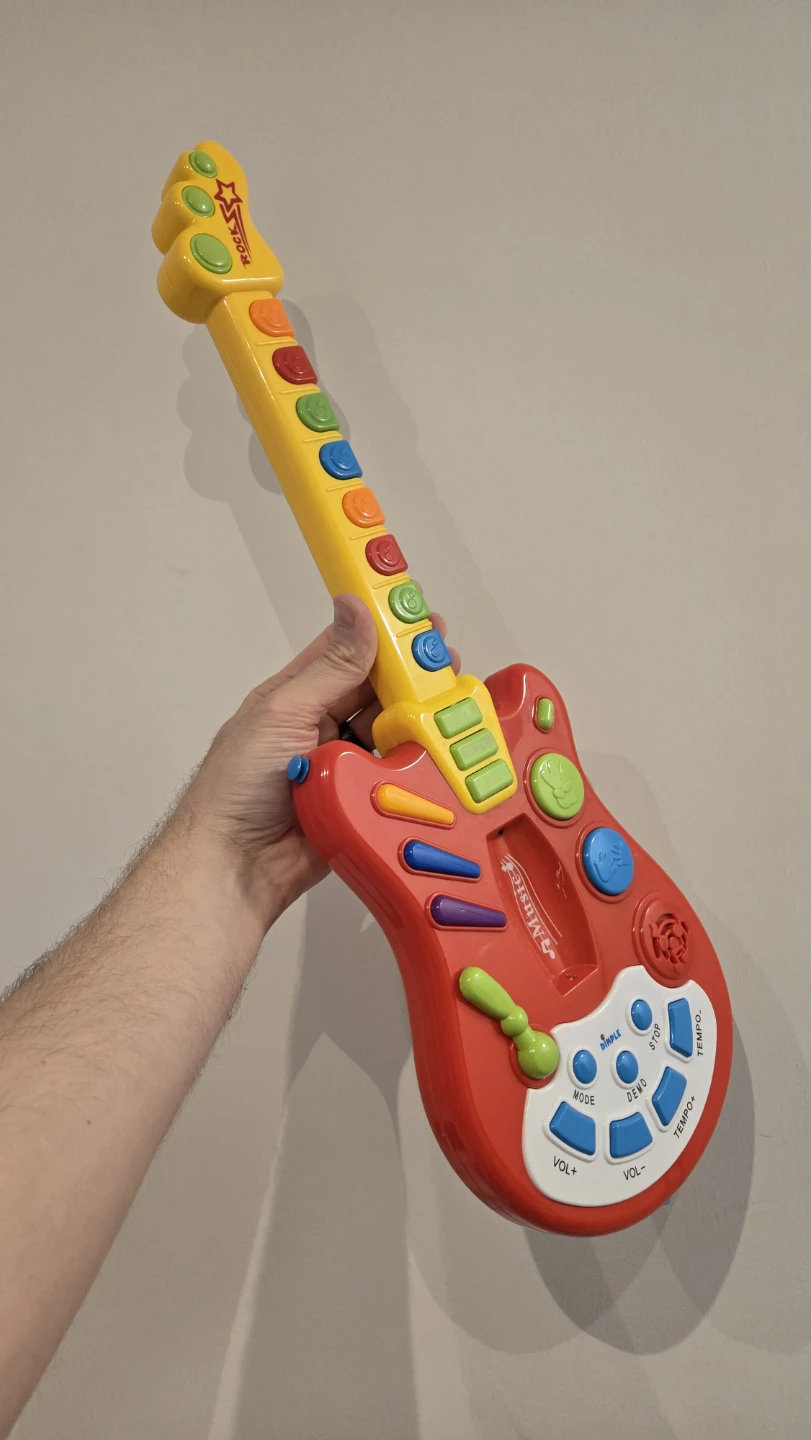 Dimple Toy Rock Guitar with Batteries. Like New