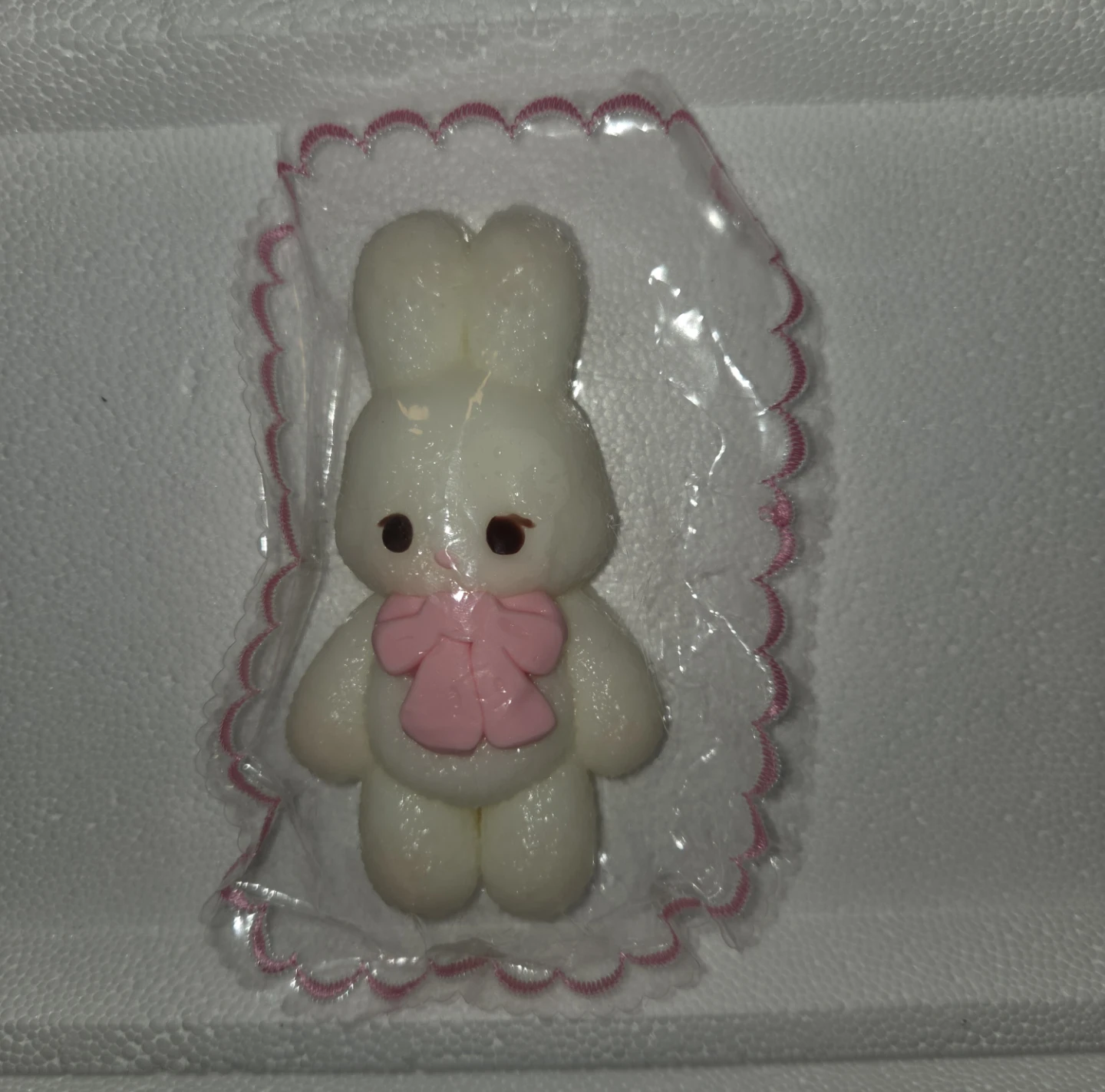 White bunny squishy with pink bow