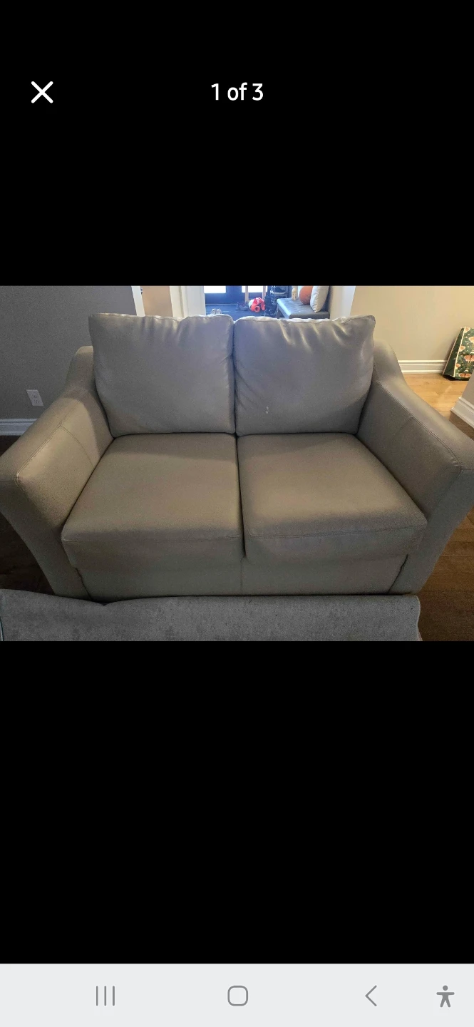 Cream leather loveseat