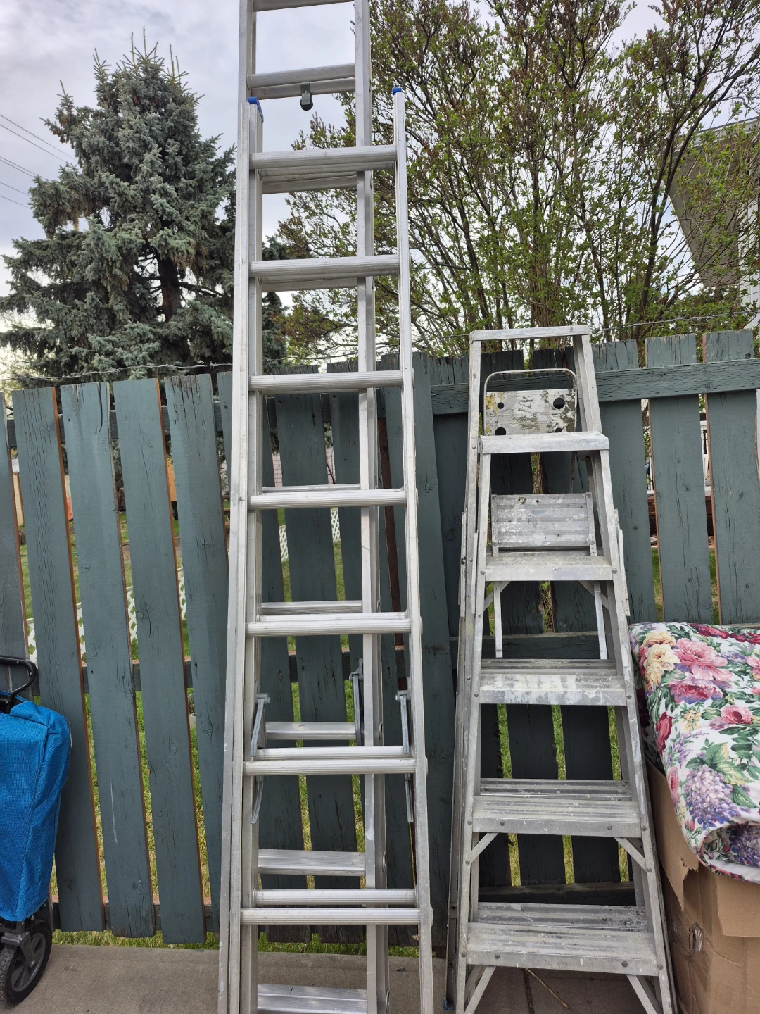 Four Aluminum Ladders two large, one medium  and one small