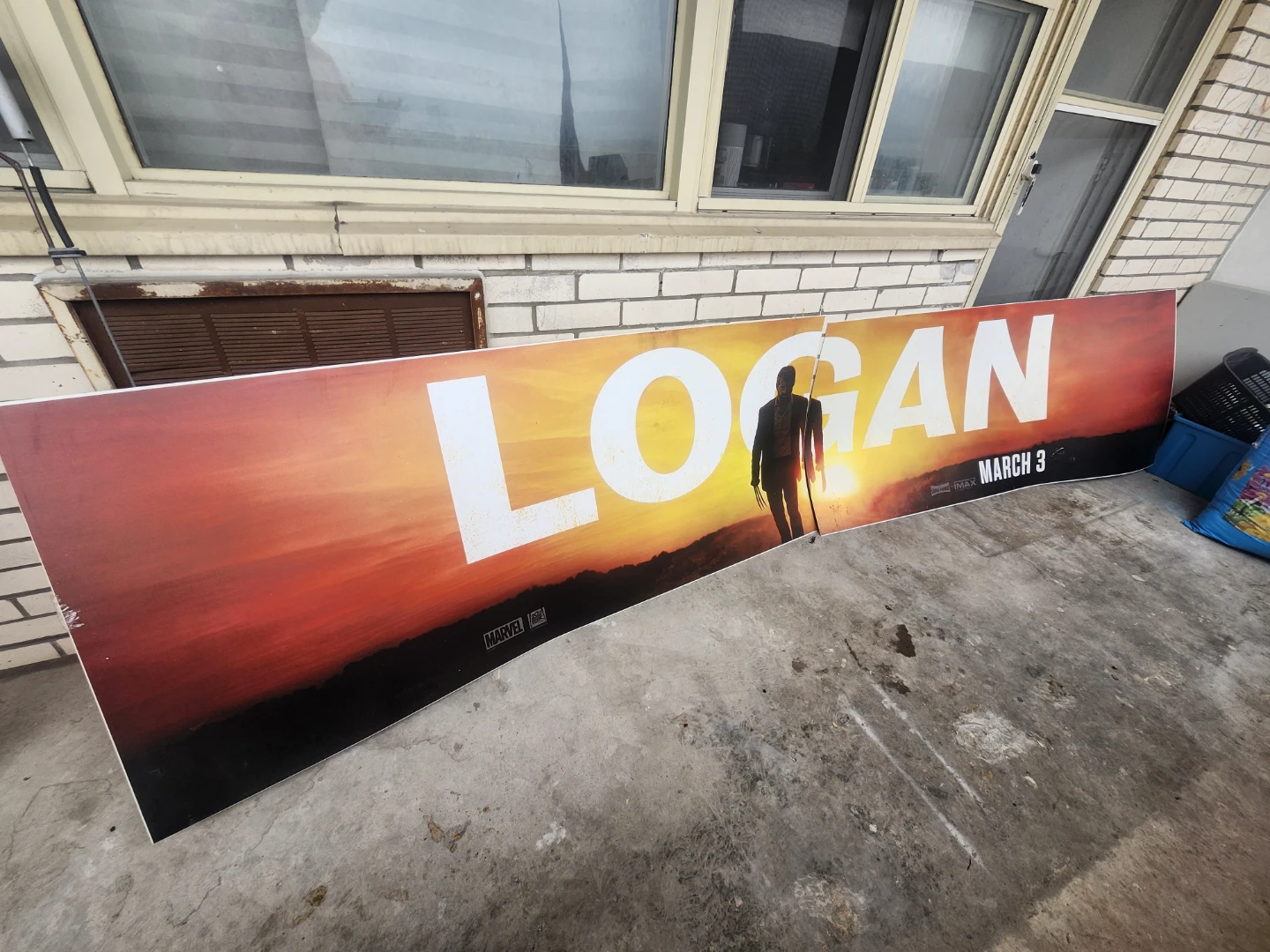 Logan Movie Poster from the side of a public bus