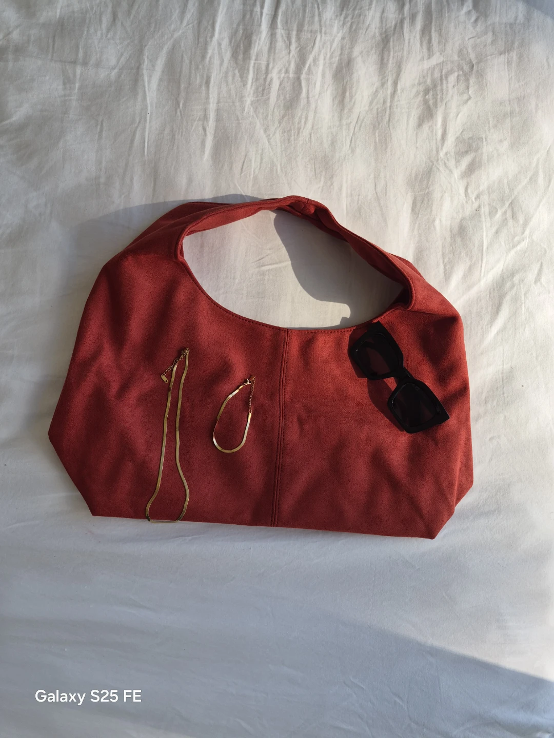Red Hobo Bag with Gold Necklace and Bracelet