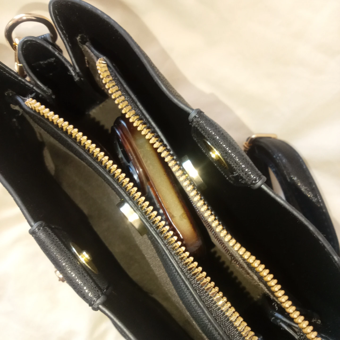 Black crossbody bag with gold accents - photo 3