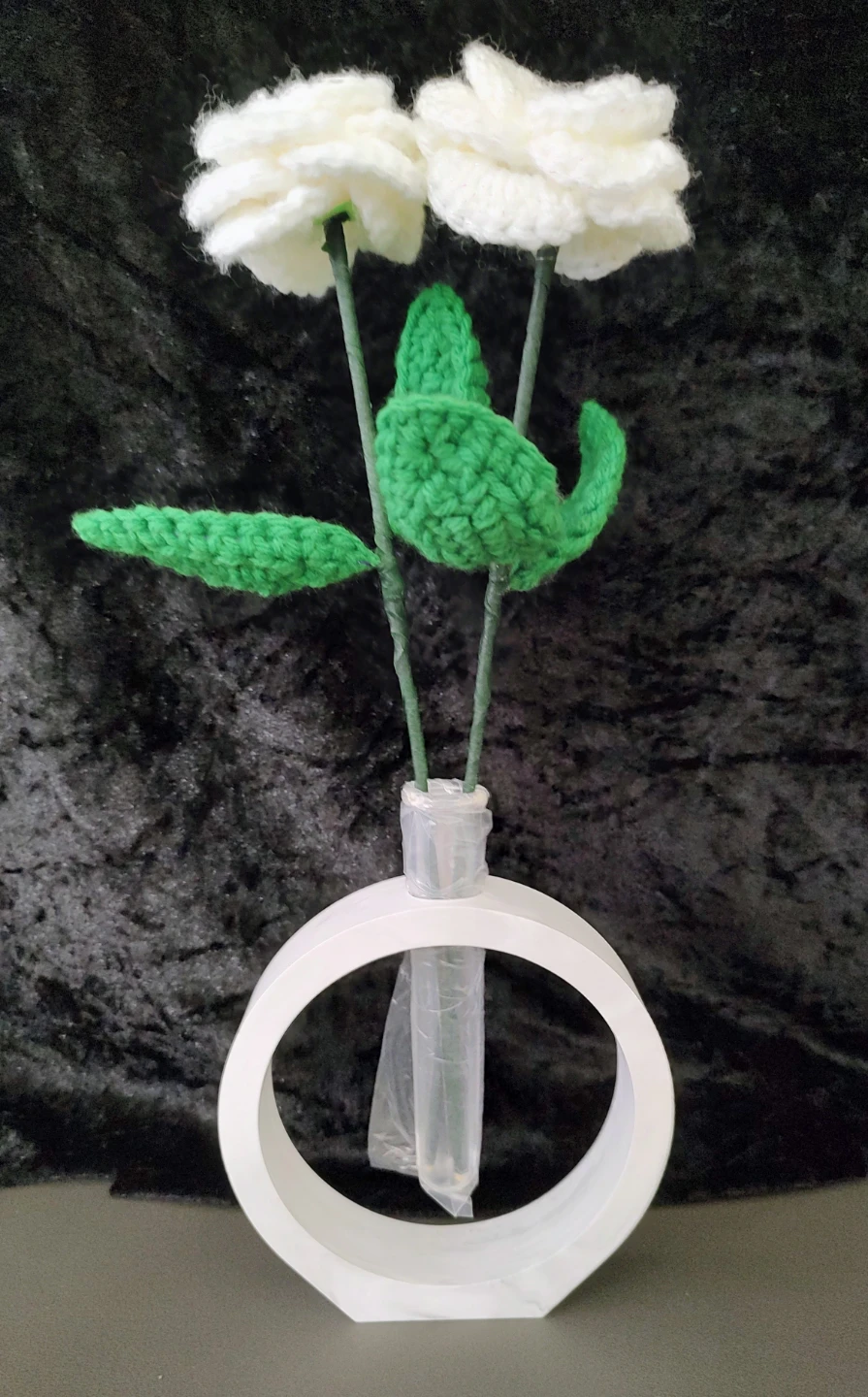 Modern minimalist vase with crocheted flowers