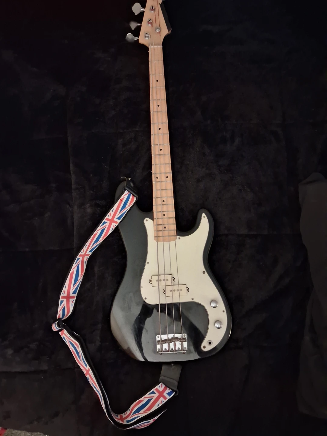 Black 4-String Bass Guitar with Union Jack Strap