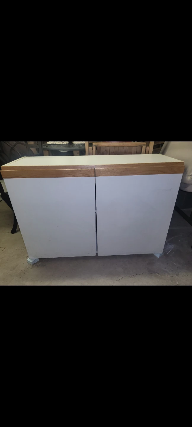 Two-door cabinet with wood accent