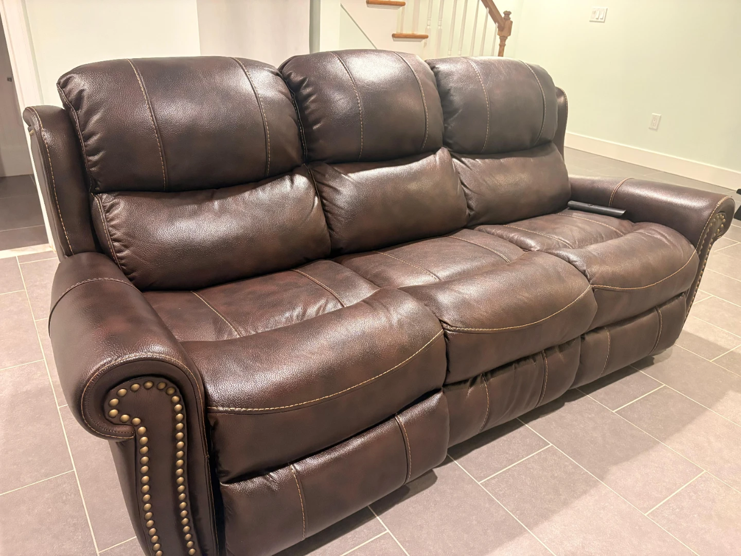 Brown Faux Leather Reclining Loveseat with Cup Holders