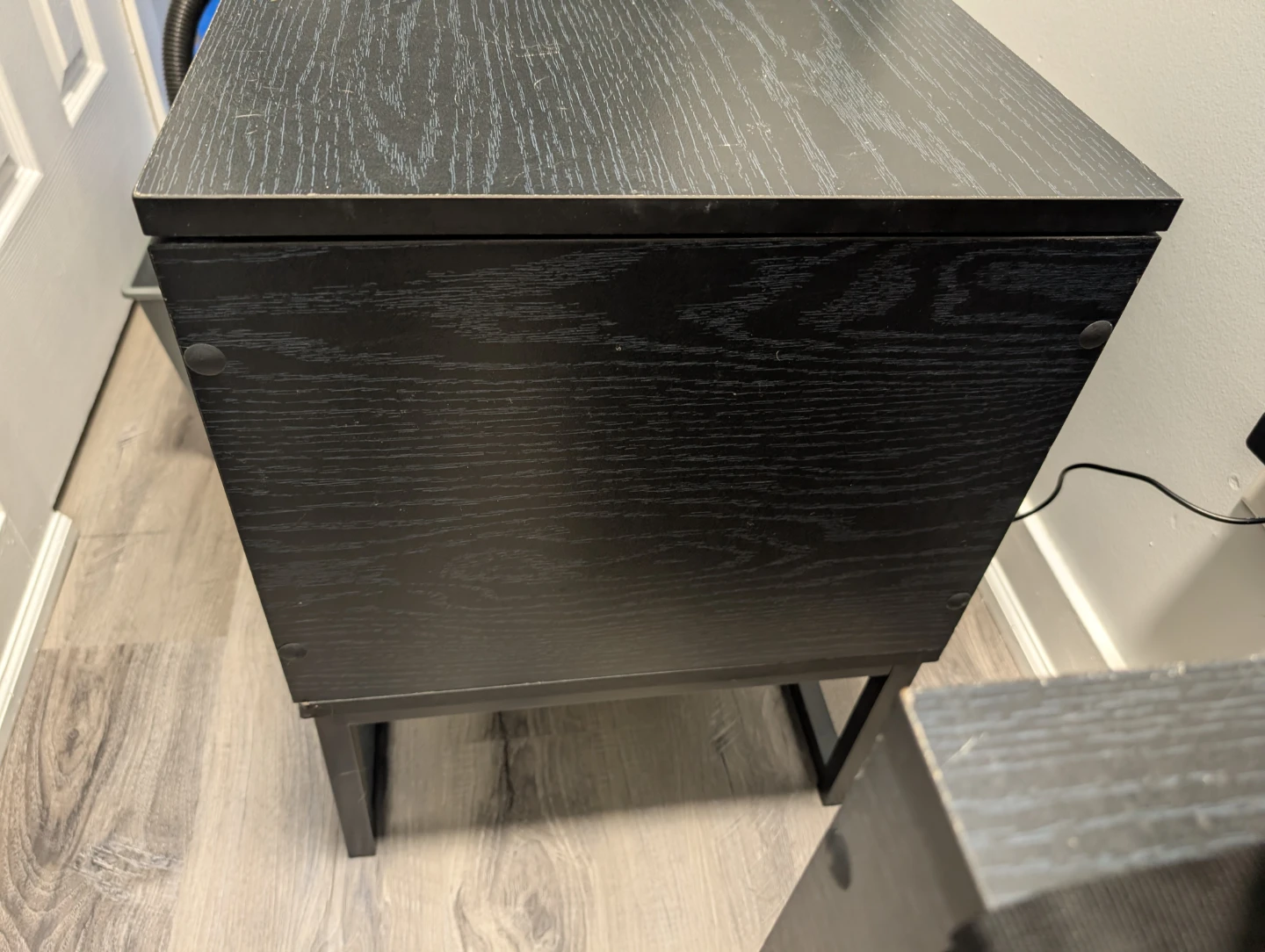 Black lift-top storage tables