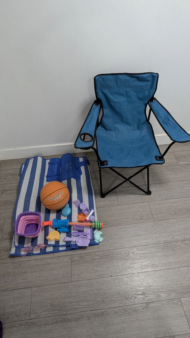 Blue Folding Camp Chair with Beach Toys and Ball