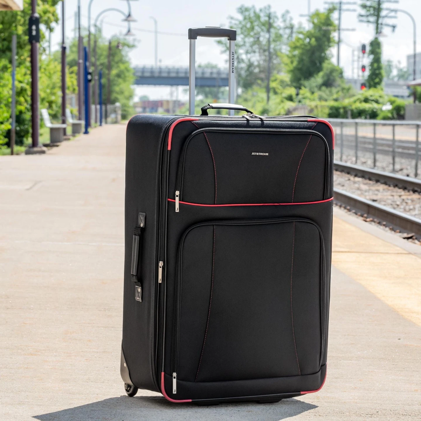 Jetstream Black Rolling Suitcase with Red Trim