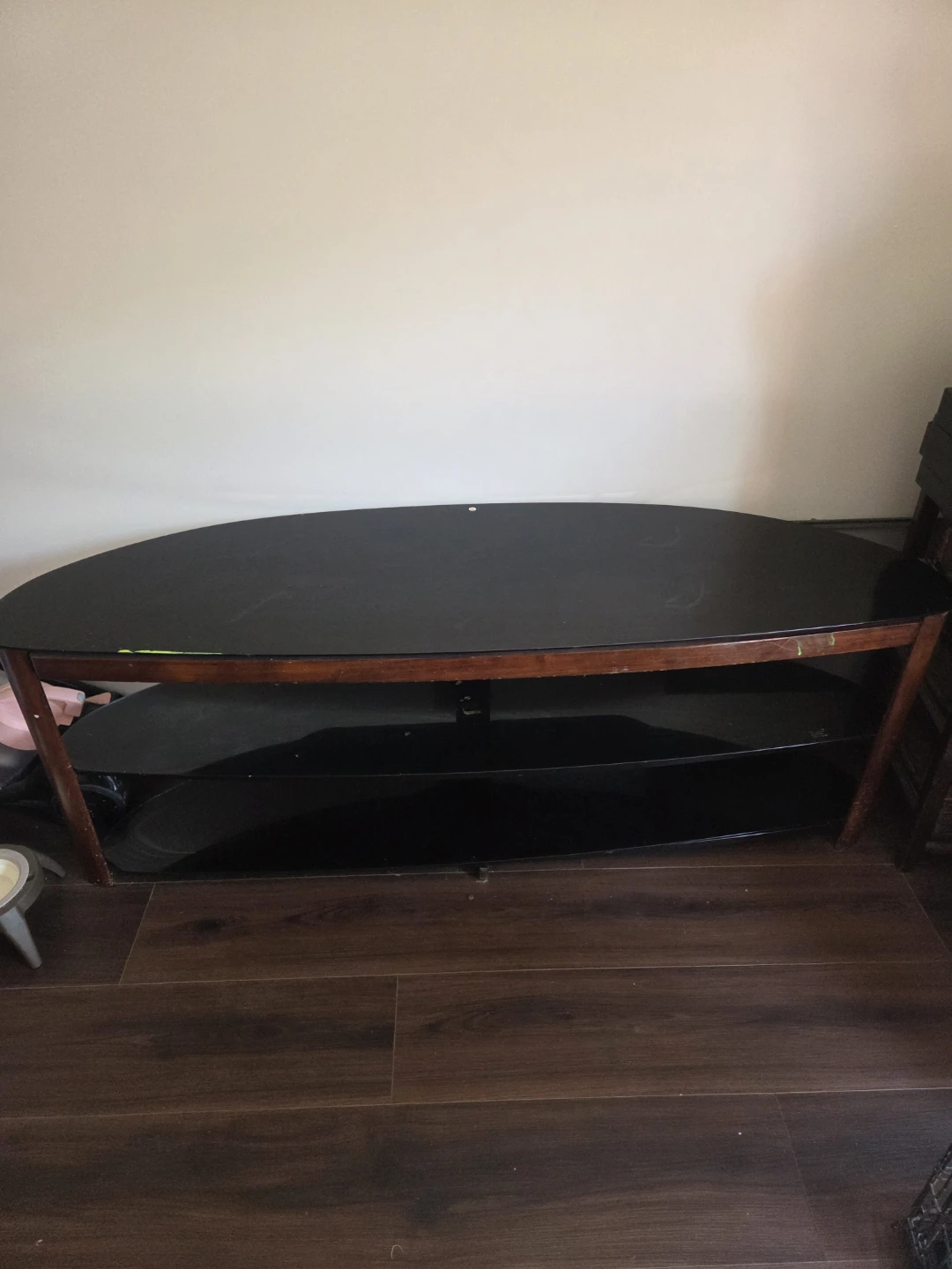 Curved Black Glass TV Stand with Wood Accents