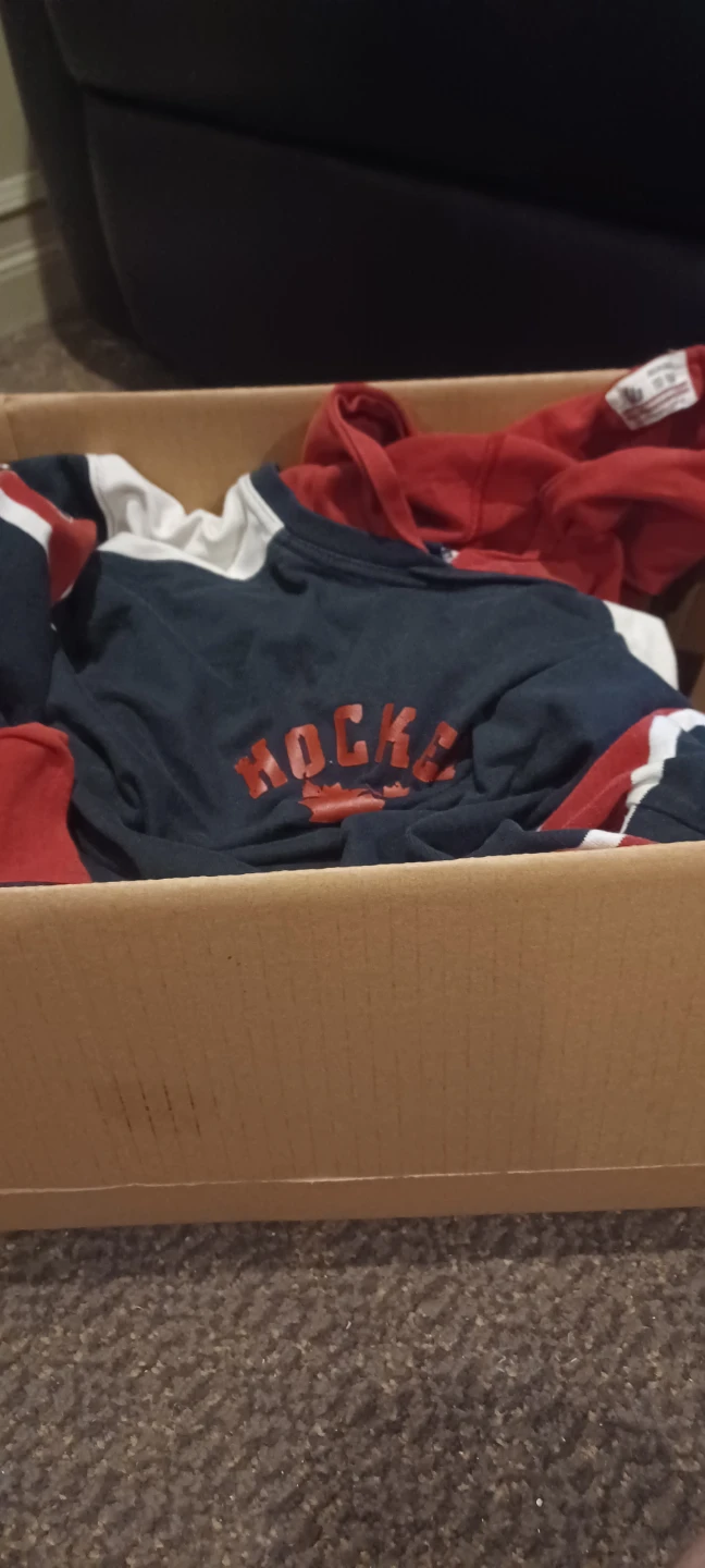 Box of boys shirts