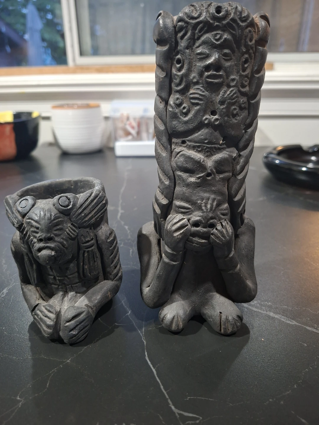 Two vintage carved stone figures