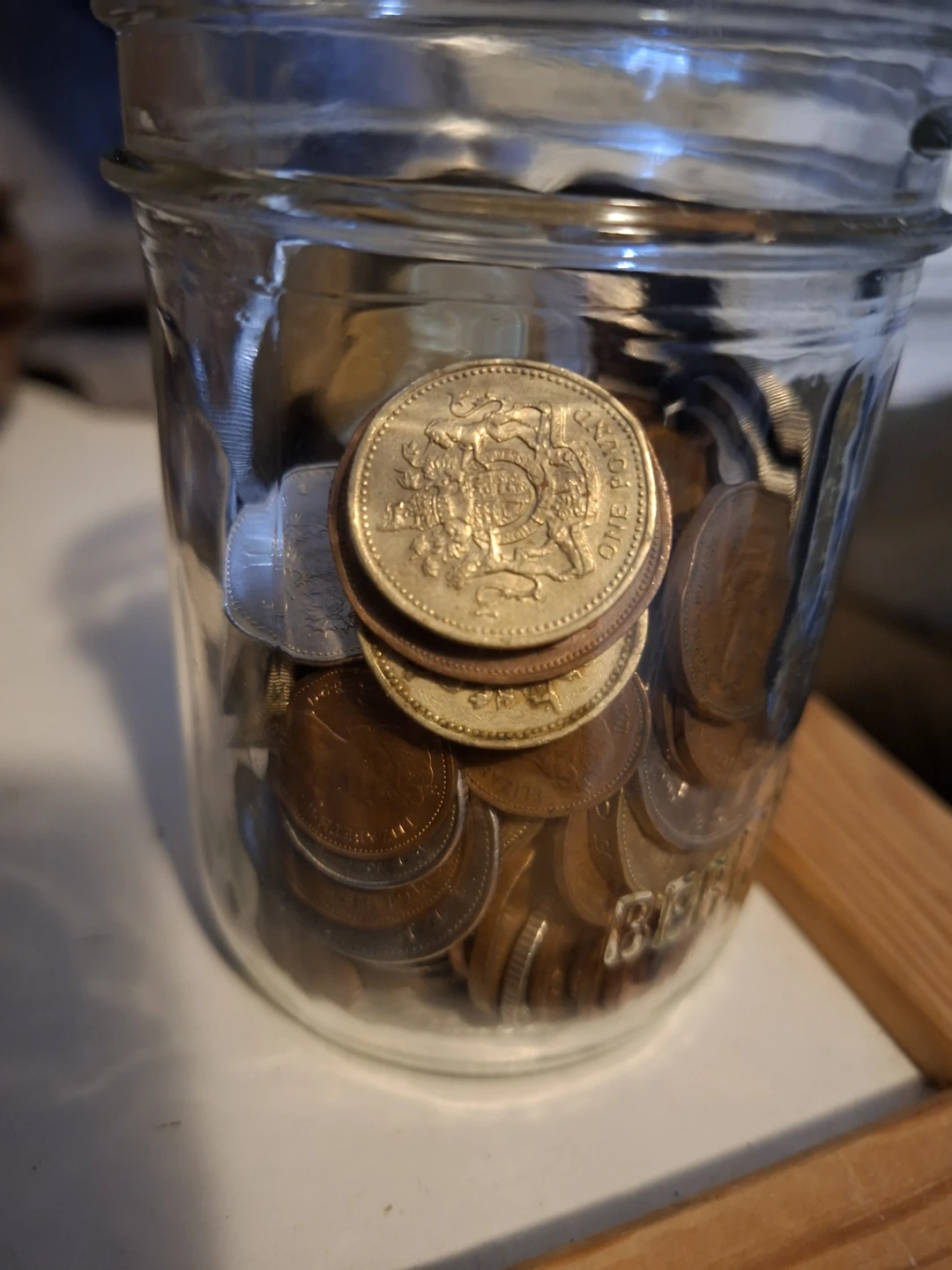 Jar full of modern British coins - photo 3