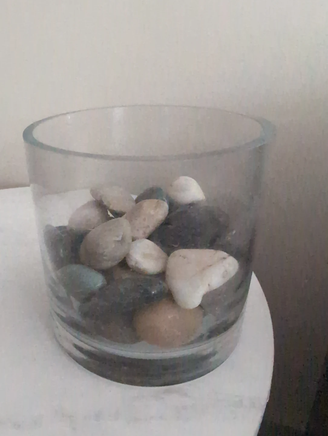 Glass vase with decorative stones