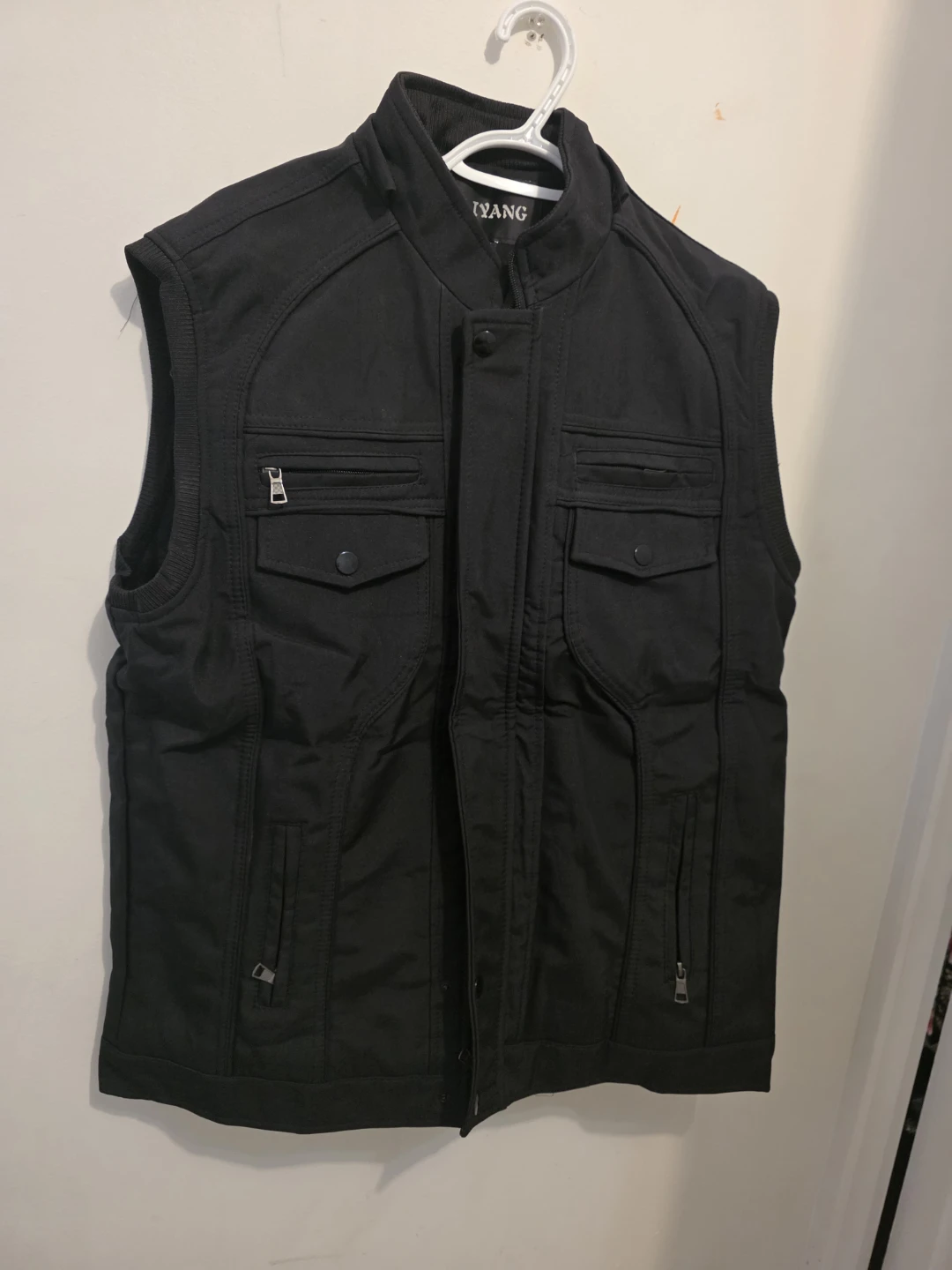 Sleeveless black warm jacket with hoodie