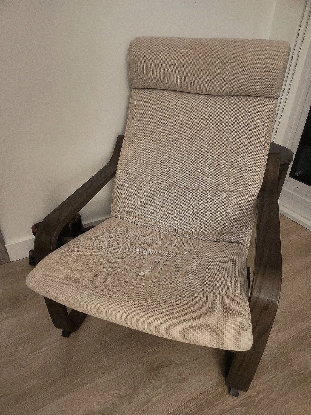 Comfortable fabric Ikea Poang lounge chair with wooden frame