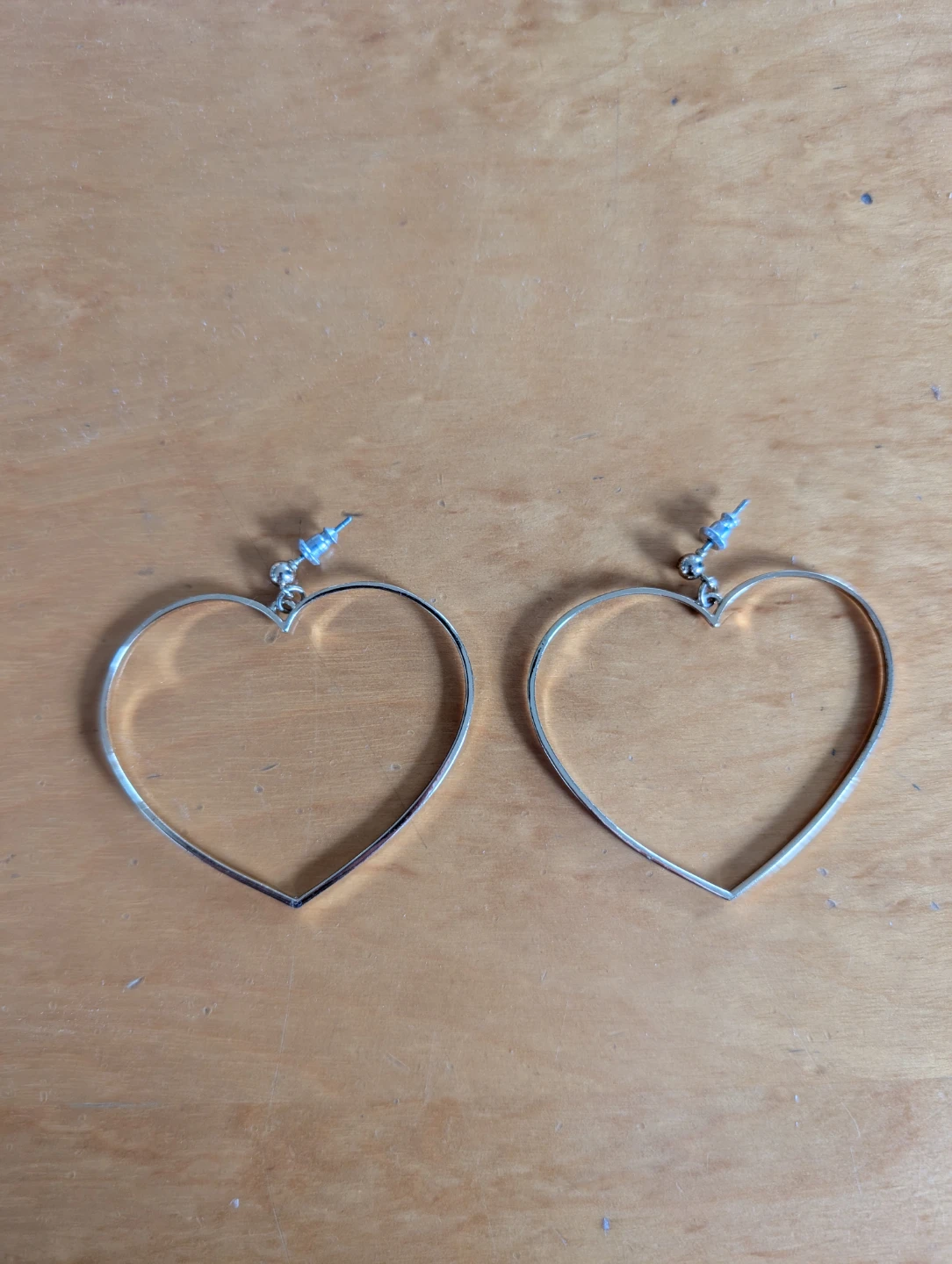 Gold heart shaped dangle earrings
