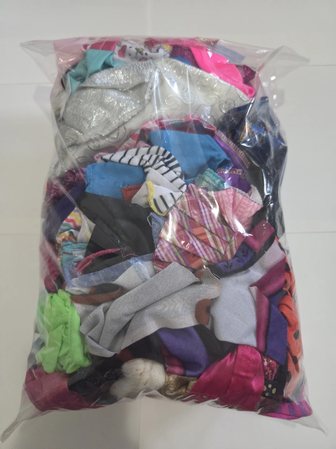 Ziploc bag of barbie doll clothes