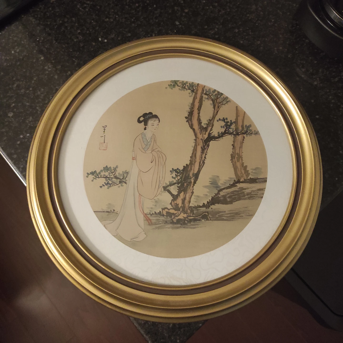 Round Framed Artwork with Asian Woman