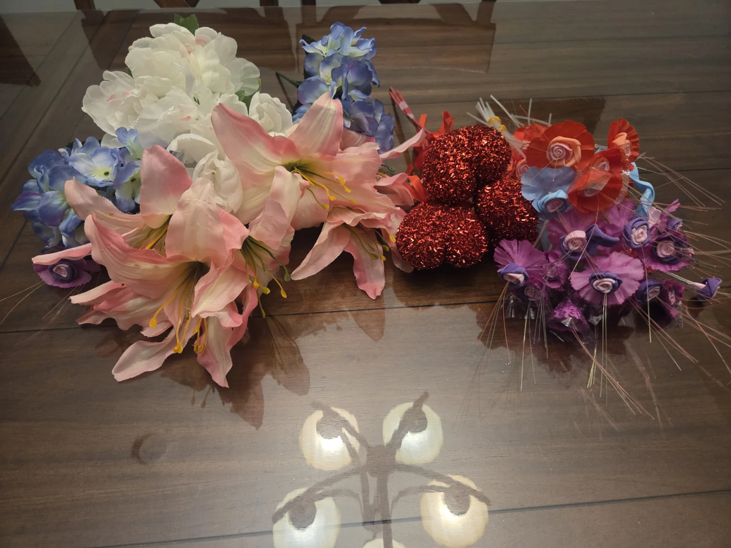 Assorted artificial flowers and heart decorations
