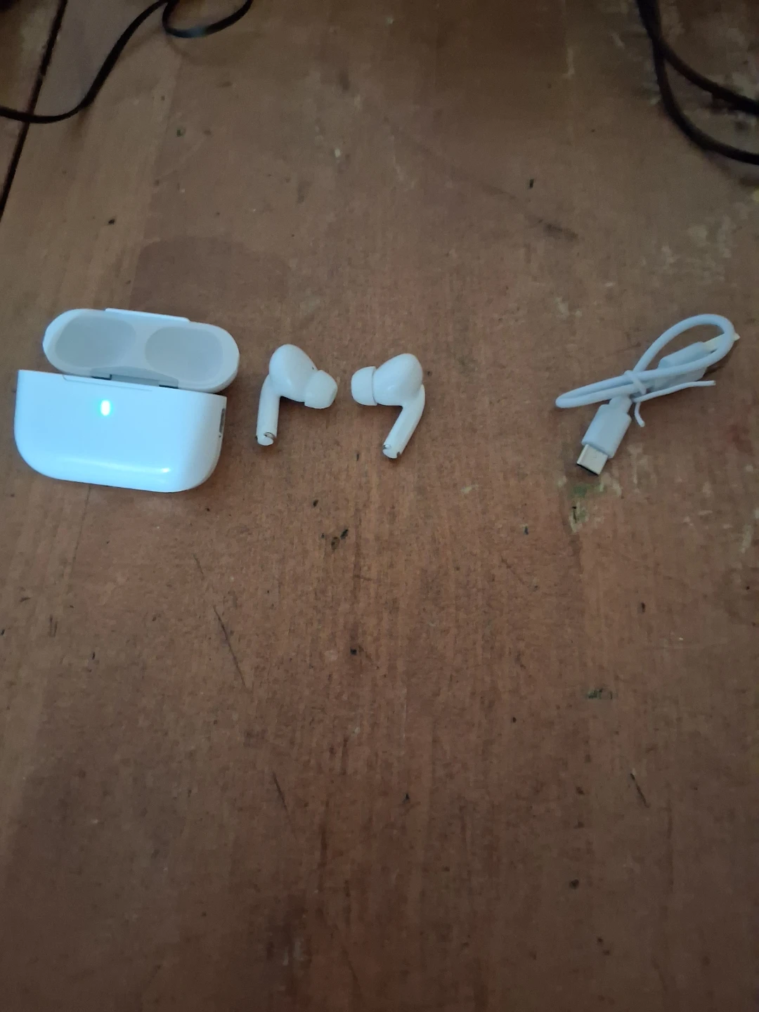 White Wireless Earbuds with Charging Case and Cable