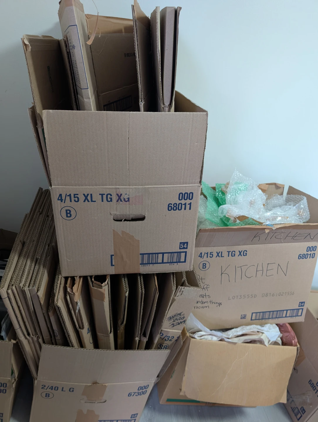 Moving boxes, bubble wrap, and packaging paper