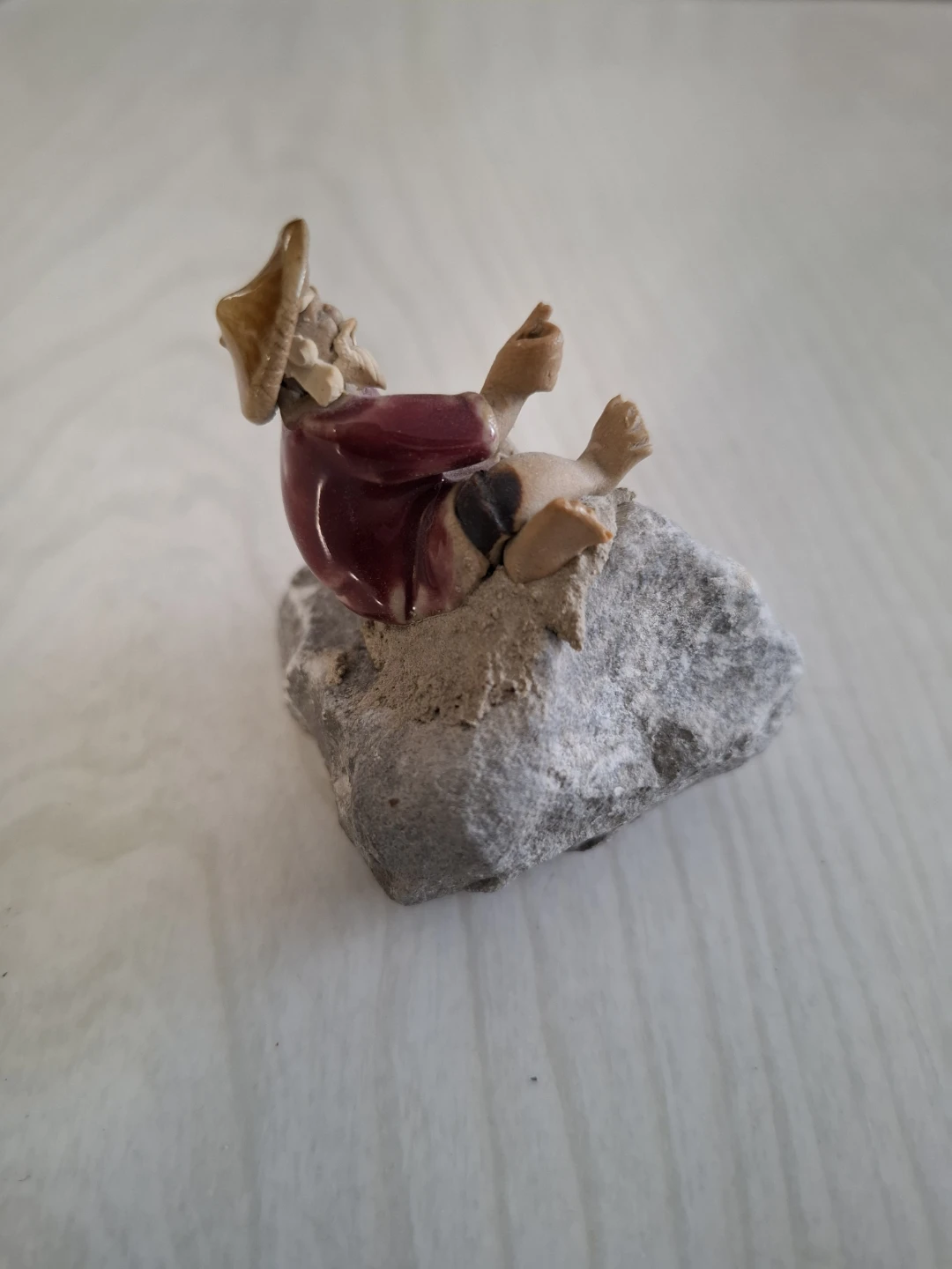 Ceramic Figurine of Man on Rock - photo 2