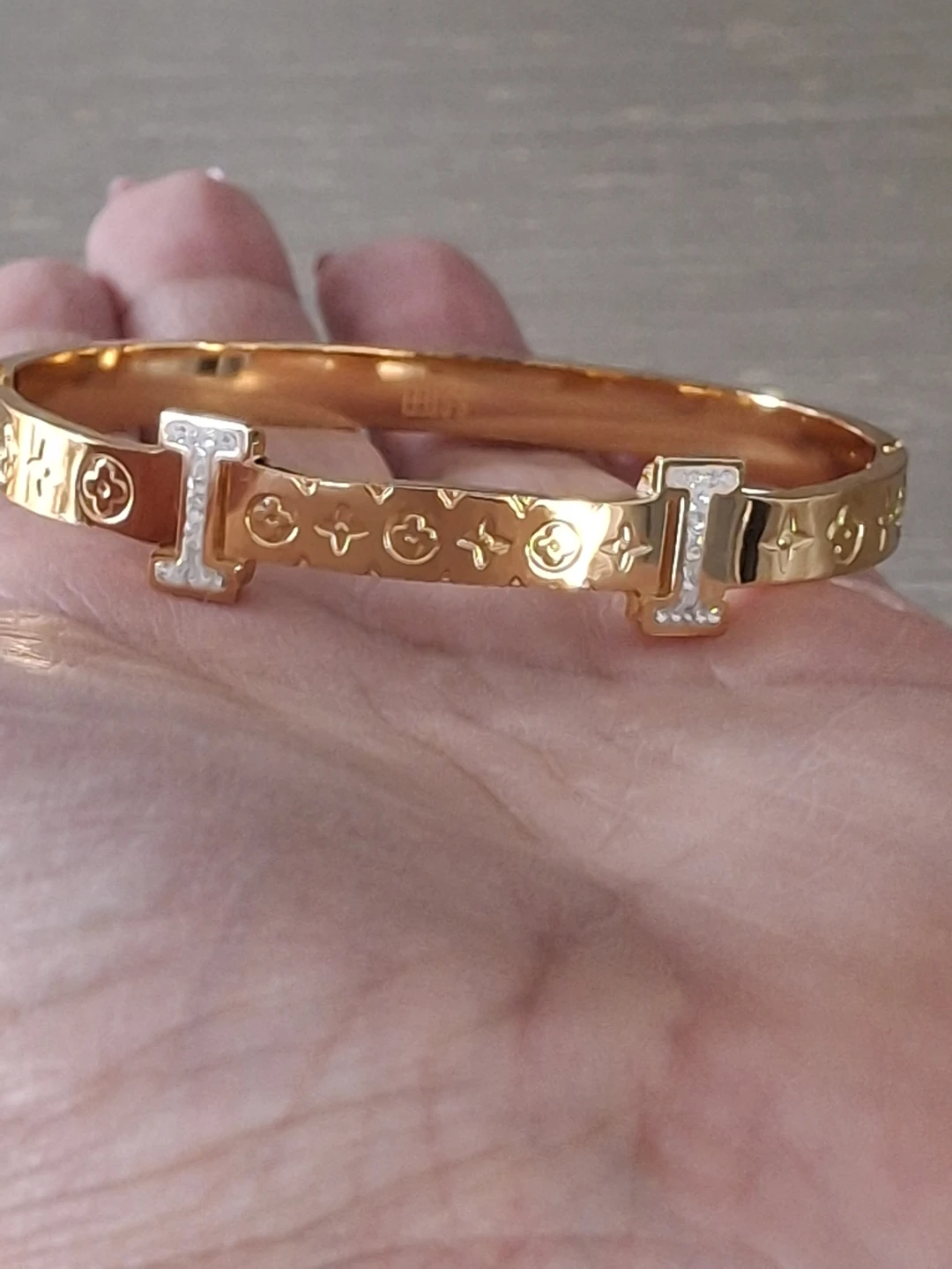 Gold tone cuff bracelet with decorative pattern and stones - photo 3