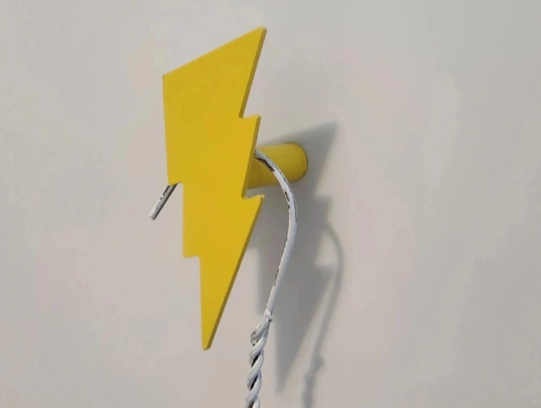 Two yellow lightning bolt hangers