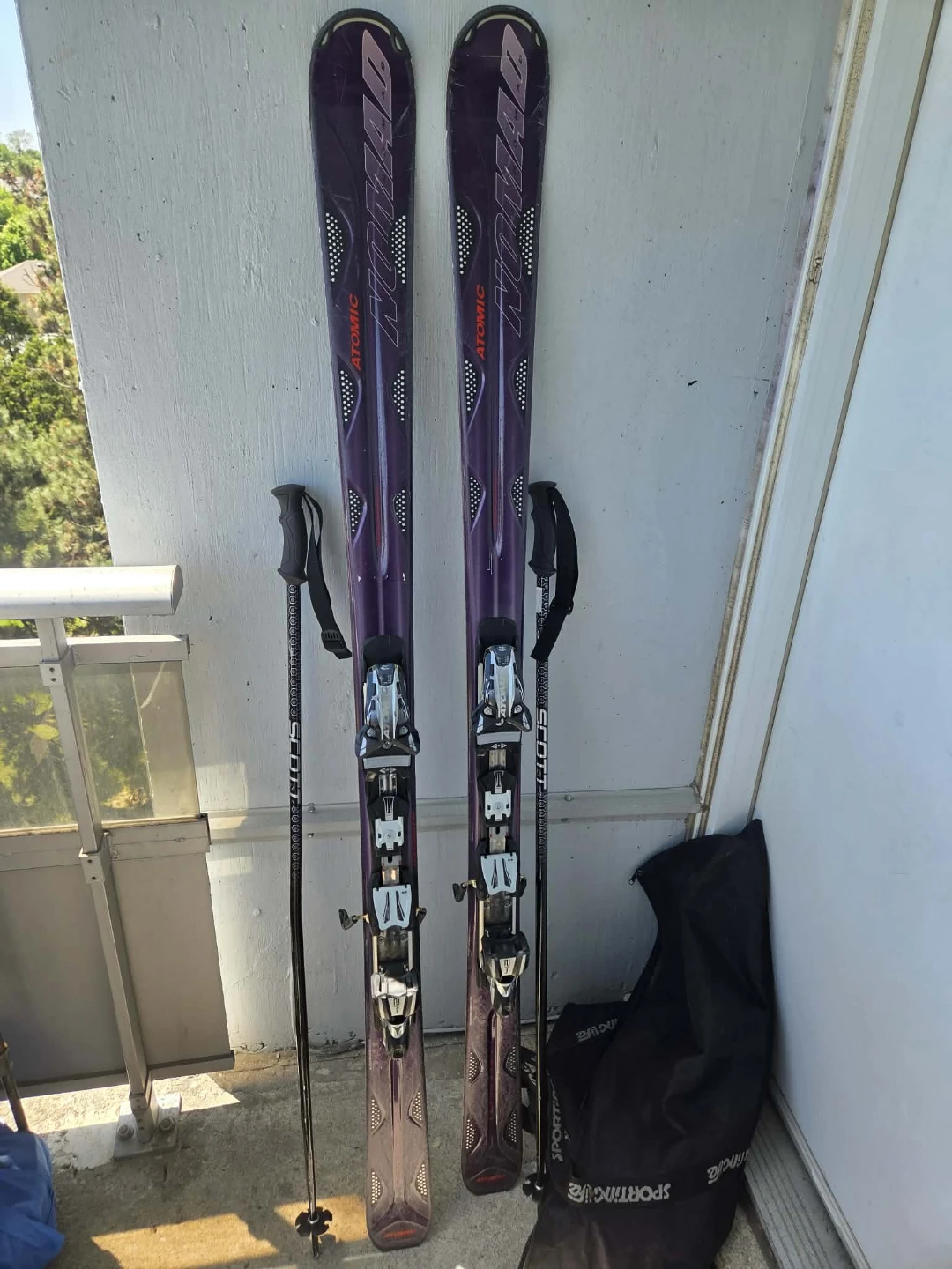Atomic Nomad skis with Scott poles and ski bag